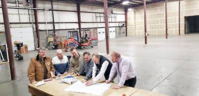 YMCA officials review expansion plans, which include a new pool, with CCI Construction Inc. and Hudson Design Architecture &amp; Construction Management in the space where the new pool will be built. From the left: Dave Morse of CCI Construction Inc.; Ira Besdansky, YMCA of Middletown CEO; Marc Savacool and Eric Savacool of CCI Construction Inc.; James Copland of Hudson Design Architecture; Ross Miceli, newly named YMCA of Middletown chief operations officer.