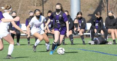 Senior Co-captain Abigail McCleary (#17) weaves through the Wildcat defense. Photos by William Dimmit.