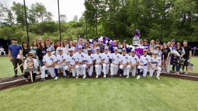 Monroe-Woodbury Crusader baseball team with seniors and their families before their last regular-season home game.