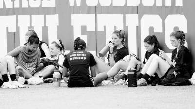 The girls take a break to hydrate during their first work out of the season.