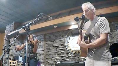 Ron Renninger performs with Elissa Jones at a Music for Humanity Free Performance Night