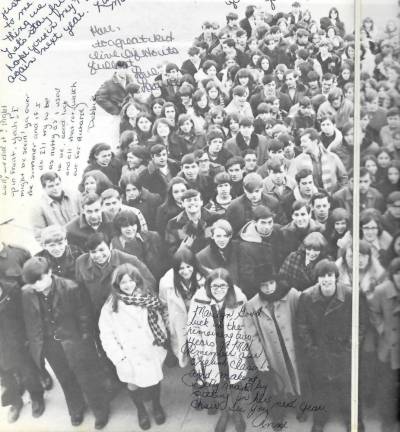 Two photos show a class picture from the 1970 yearbook taken while standing on the roof of what is now an elementary school on Route 32 but was the first M-W high school.