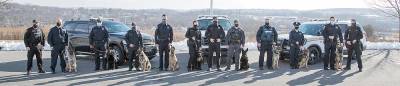 Nine handlers and their K-9 partners graduated last week from the Orange County Sheriff’s Office K-9 Detector School. Included in the group was Officer Melissa C. Berke of the Village of Monroe Police Department, pictured here with her K-9 Keen third from the right.