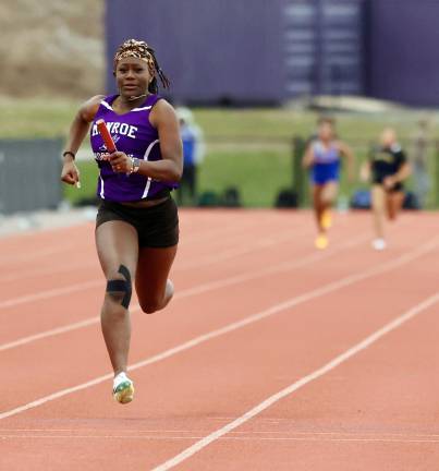 YvonneMae Campbell has the lead as as the Crusaders win the 4x100 Relay.