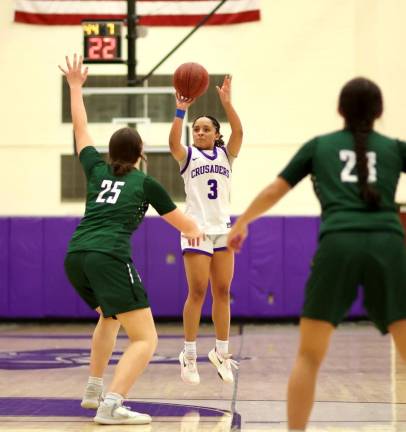 Madison Fileen (#3) scored 26 with 6 three-point shots to lead the Crusaders.