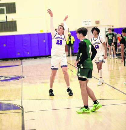 Kyle McDermott, #23, hits a 3-point shot as the buzzer sounds.