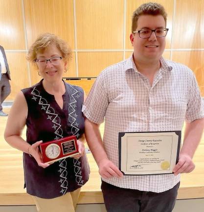 Tony Maggio’s wife and son: Tracy Maggio and Andrew Maggio, pictured with awards.