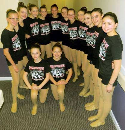 Almost show time and ready to perform are, from the left: Meghan Jezik, Kerry Behringer, Jenna Sommerlad, Lily Schoenherr, Kelly Teel, Maura Lennon, Lily Cohen, Alexis Newman, Adelia Salerno, Juliet Hennessy and Caleigh Ingram. Kneeling: Jenna Sommerlad and Carleigh Newman.