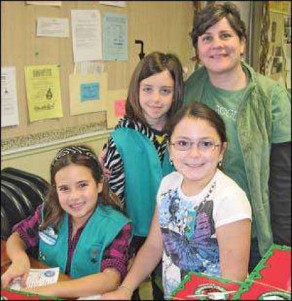 Among the “helpers” at the “Operation Christmas Child Shoebox Project” at the Highland Mills United Methodist Church recently were some of the Girl Scouts from Troop 56 in Cornwall led by Troop Co-Leader Jen Tejeda.