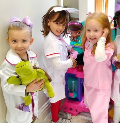 Local vets Lily Krauss, Layla Lesko and Kate Hassler of Mrs. Crissy Gargano's class take care of pets.