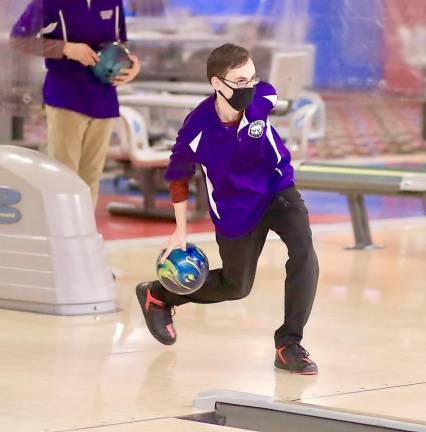 Senior Sean Mende lets a shot fly as the action heats up.