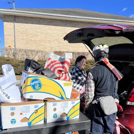 A donation from Alpine School is dropped off at the Sparta Community Food Pantry, which recently has been seeing up to 100 people each day. (Photo provided)