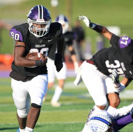 Defensive linemen Alan Ramirez races down the sideline after he recovered a Middletown fumble for a touchdown to end the first half.