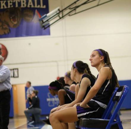 Senior Caroline Helbeck watches the scoreboard as the Crusaders record their first victory of the year.