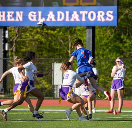 Goshen High School’s Scarlett Winkler, in blue, takes on Monroe-Woodbury last season. (Photo provided)