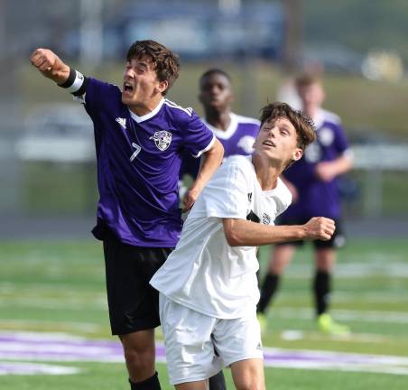 Chris Ryan (#7) battles with a Dragon defender for position.