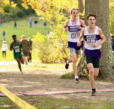 Crusader Collin Catherwood leads team mate Collin Gilstrap with about one mile to go in the race on Thursday at Bear Mountain State Park.