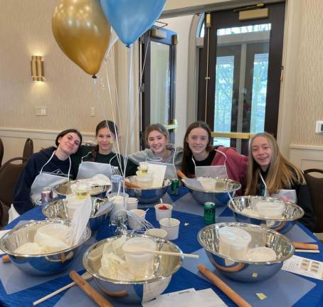 Families bake Hamantashin in preparation for Purim holiday