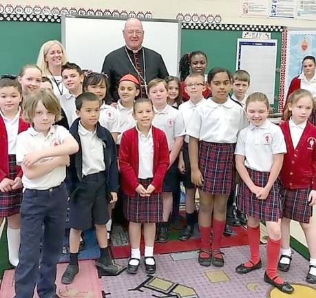 Cardinal Timothy Dolan during a visit with students at Sacred Heart School in Monroe. Provided photo,