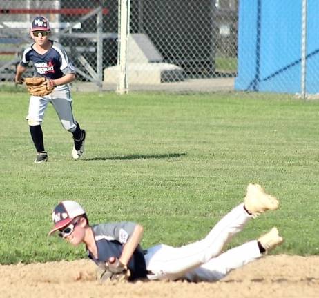 Jake Bond flashes the leather making a diving stop in the section championship game.