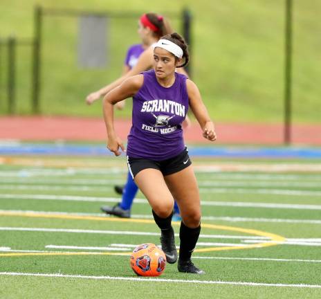 Senior Emily Harwood moves the ball through midfield against the Norsemen of Northern Valley Regional High School in New Jersey.