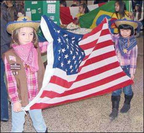 Food fest and 'SWAP' trading highlight annual Monroe Girl Scout World Thinking Day