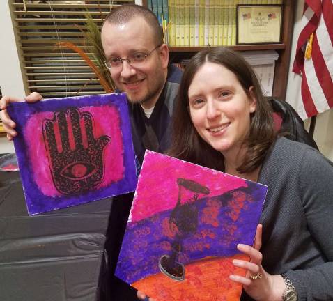Lee and Michelle Sentell of Monroe display their creations at the Jewish Pop Art event.