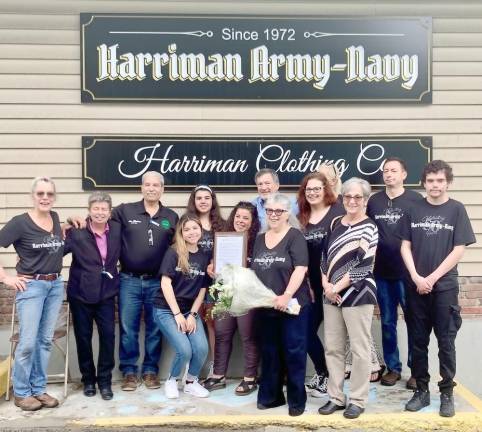 Pictured are Harriman Army-Navy owners Madelyn Goldberg and Jennifer Carrillo; Village of Harriman Mayor and Board members, and employees of the Harriman Army-Navy.