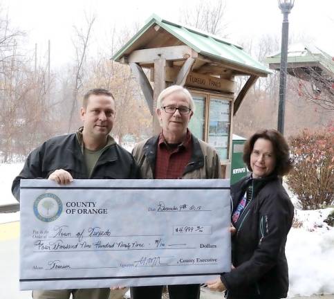 Provided photo Orange County Executive Steven M. Neuhaus presented officials from the Town of Tuxedo a $4,999 check on Dec. 9 to help promote tourism in the town. Pictured from left to right are: Neuhaus, Town of Supervisor-Elect Ken English and Town of Tuxedo Councilwoman Michele Lindsay.