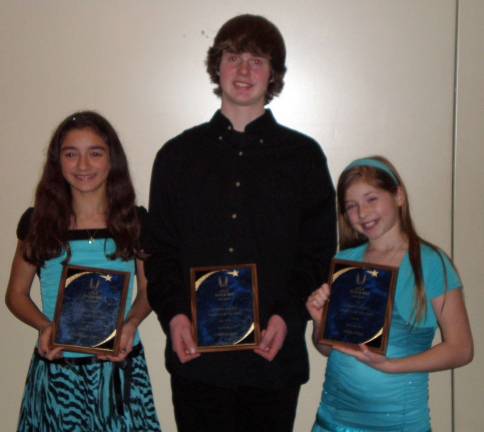 Photo provided by Barbara Napoli Three members of the Monroe Woodbury Jr. Track and Field Team were honored as the USA Track and Field New Jersey Youth Athlete of the Year for their accomplishments in the 2011 spring track and cross country season. An awards banquet was held in Edison, N.J., in late January. Receiving this award were in the Bantam girls division ( 9-10 year-olds: Tessa Lytle for the throwing event and Daniella Napoli for cross country. Also receiving an award was Casey Kiefer for Youth boys ( 13-14 year-olds) for race walking. Monroe-Woodbury Jr. Track and Field competes as part of the N.J. Striders.