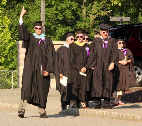 Principal David Bernsley led the members of the graduating class of 2016 from the auditorium to their seats in front of the main entrance.