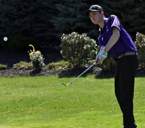 Chris Kelly chips a shot on to to the second green; he turned in a round of 40.