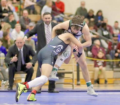 Santos Ocasio lifts his opponent into the air as he attempts a takedown in his final match at 120 lbs.