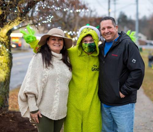 Jean and Lou Messia with the grinch Marcello.