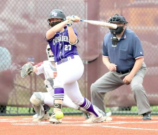 Emma Lawson (#27) doubles to left in the first inning. Photos by William Dimmit.