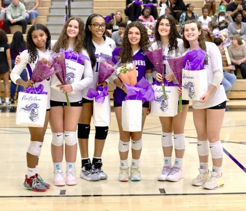 From left, Crusader volleyball seniors Natalee Cabrera, Grace Kobylinski, Kailyn Simon, Jolene Llanos, Julianna Fini, and Briann Grove.