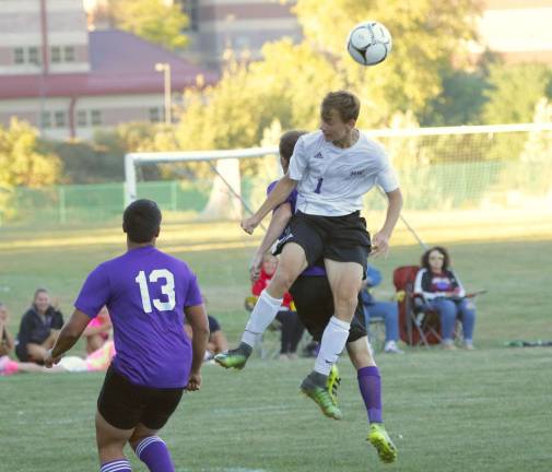 Photos by William Dimmit Petro Klisch (#1) heads a shot in front of the Wildcat goal.