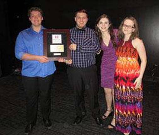 From left: Trevor Nardone, Jared Freligh, Mackenzie Hintze, and Sarah Dworjan, accept the First Place gold award for Chorus.