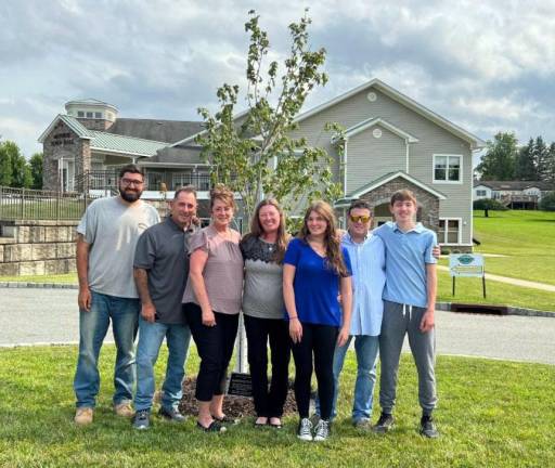 The family of Elizabeth “Betty” Sapp, the longtime Town of Monroe employee, at the dedication of a tree planted in her memory. Photos provided by the Town of Monroe.