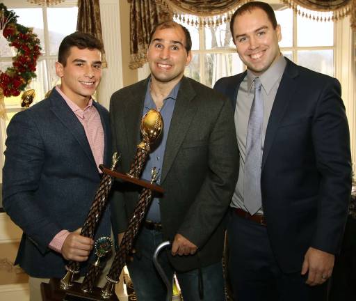 Photos by William Dimmit Vinnie Scancarello on left, receives the þÄúNeil Ingenito Defensive Player of the year Award" from Neil Ingenito, center, and Coach Matt McCullagh on right.