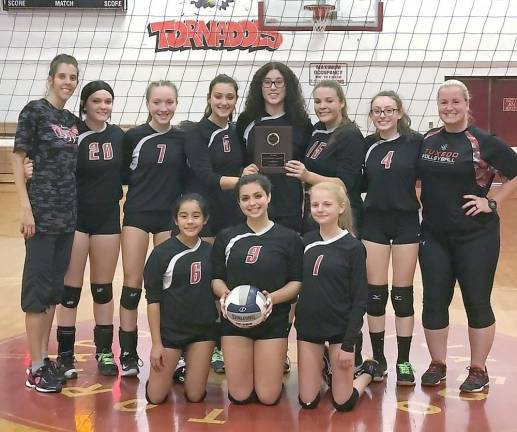 The Division IV Volleyball Champions from George F. Baker High School in Tuxedo are, beginning in the front row from left to right: Vanessa Duarte, Sophia Ruscillo and Anastasia Vishnevskaya; and in back, from left: Coach Jessica Schweitzer, Talia Posta, Juliana Scanlon, Julia Ruscillo, Natalyn Peralta, Emma Maynard, Marisa Leo and Coach Michelle Hines.