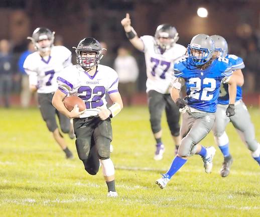 Nicholas Calderone (#22) scores on this 50-yard touchdown to give the Crusaders the lead