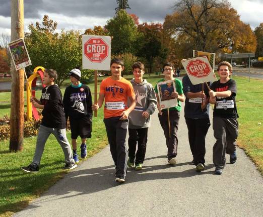 Young people, as seen here at a previous walk, are frequent and ardent participants in the Monroe CROP Hunger Walk.