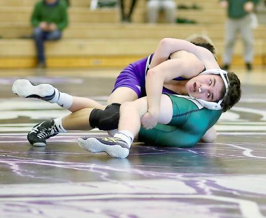 Crusader Dan Connelly, with cotton stuffed into his nose to stop the bleeding, took a 17-13 decision in overtime in the match of the night.