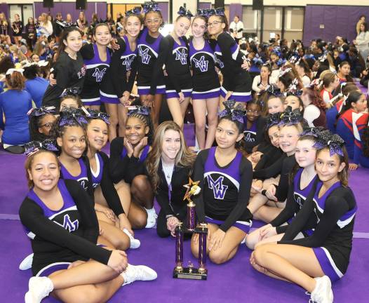 The Crusader Modified cheer team celebrities their victory.