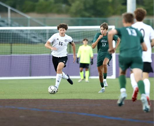 Jayden Scamarone (#14) scored off a scramble to wrap up the Crusaders opening Day victory.