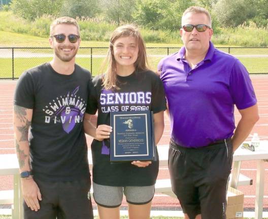 Meghan Catherwood receives her Female Athlete of the Year Award from Coaches Patrick Capriglione and William Earl.