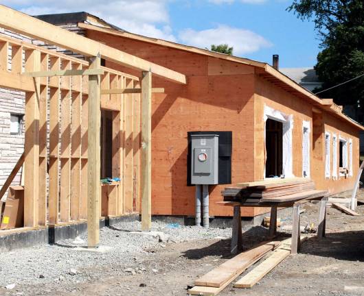 The library's new public entrance and foyer were framed out by late summer.