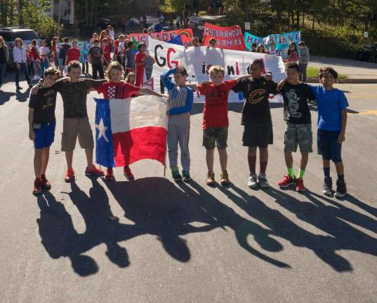 Provided photos Pictured from left to right, the students holding the flag are: Joe Hubert, Danny Basciano, Jimmy Reedy, Sam Kainatsky, Kevin Mints, Sean Essoka, Aidan Waller and Gio Ortiz.