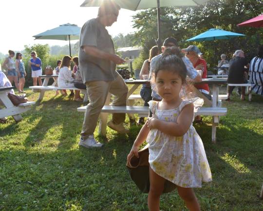 Dahlia Colon, daughter of Ozzie Colon and Lauren Mariotti, with the garden toolbag awarded to winning gardens. The family’s Warwick, N.Y., garden took second place. (Photo by Becca Tucker)